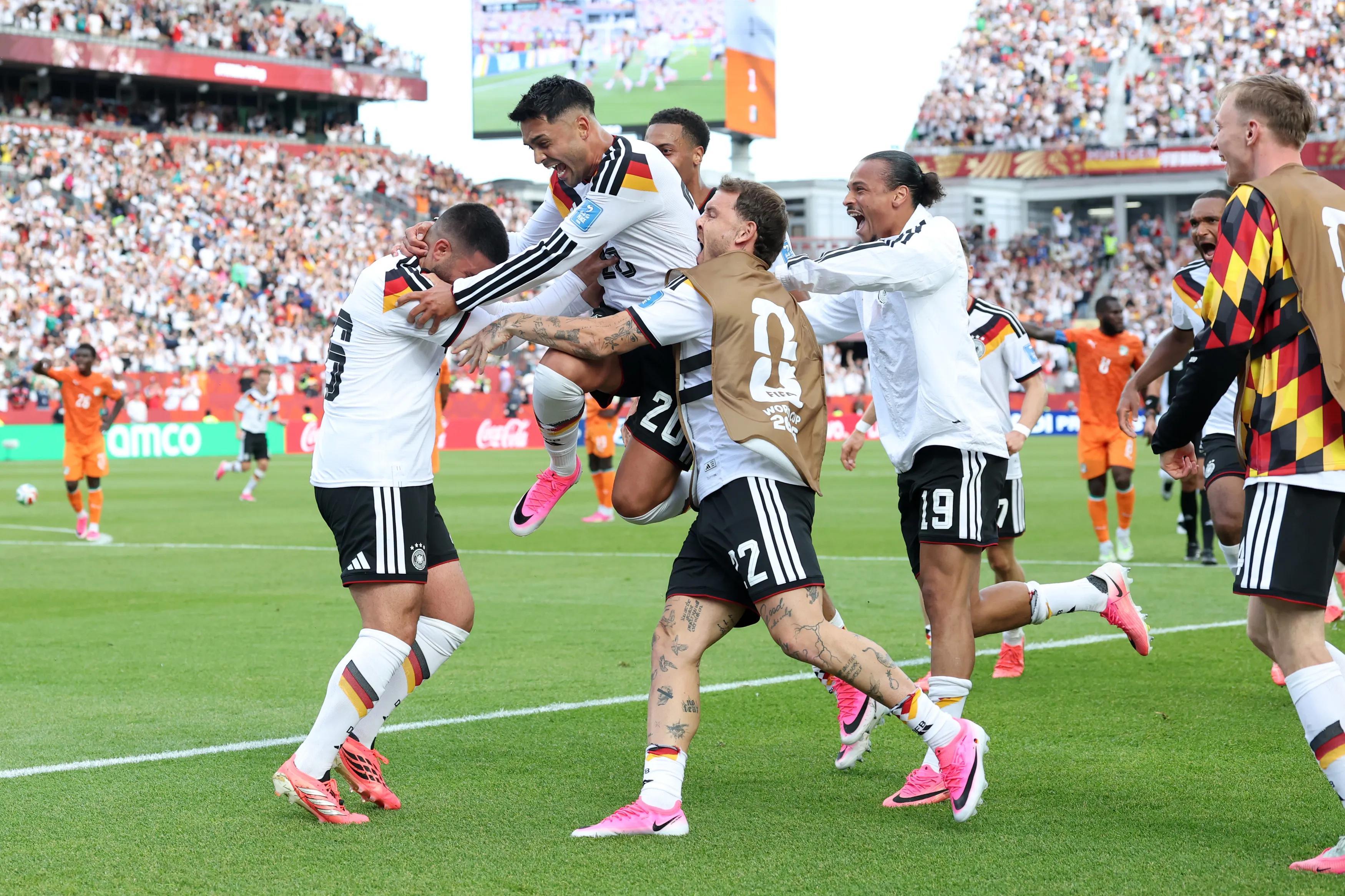 Germany escape from the brink and book their knockout ticket in a life-or-death showdown